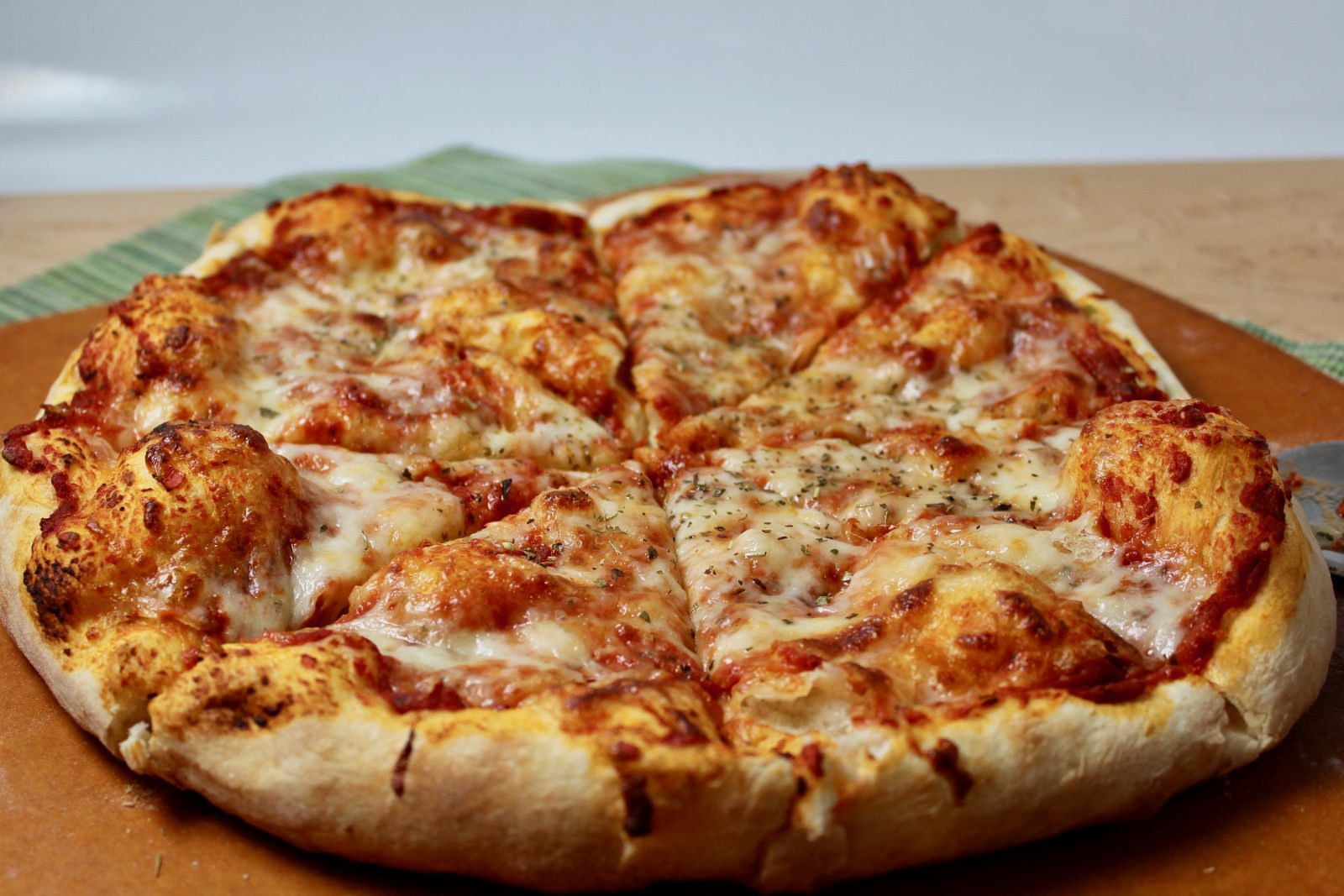 Pizza Siciliana, round pizza with light crispy crust, topped with