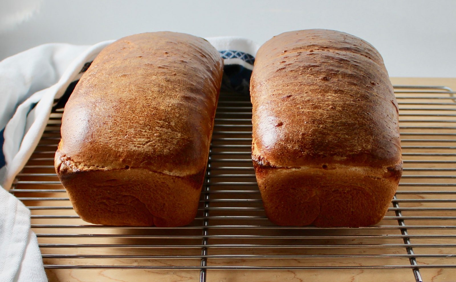 https://www.epicuricloud.com/wp-content/uploads/2020/03/Simple-Homemade-White-Bread-2-loaves-uncut-1600x989.jpg
