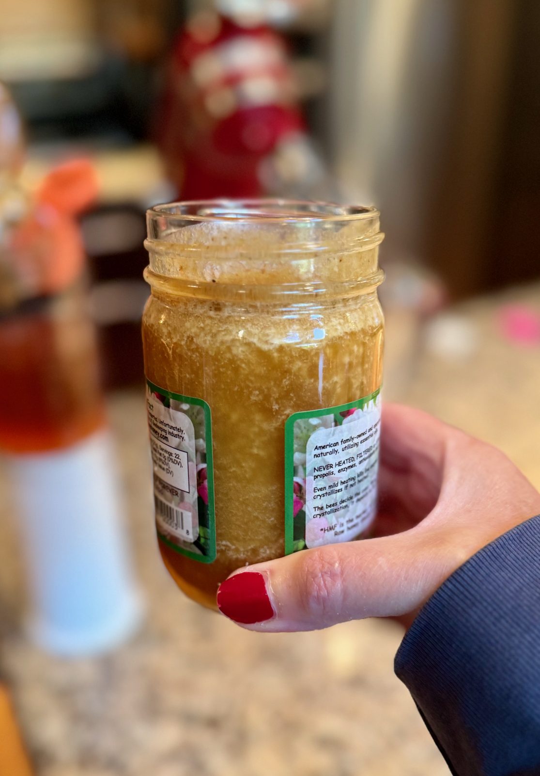 Side view of jar of crystallized honey.