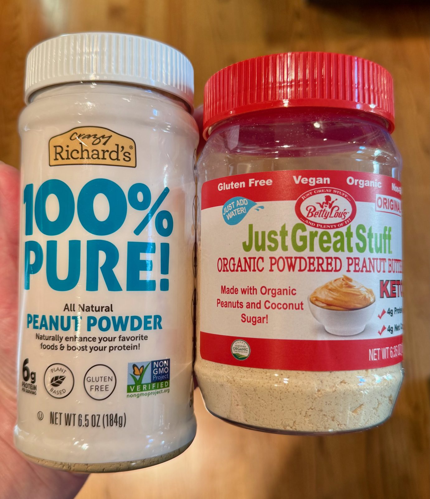 Two jars of peanut butter powder to be used in recipe for Greek Yogurt Cups.